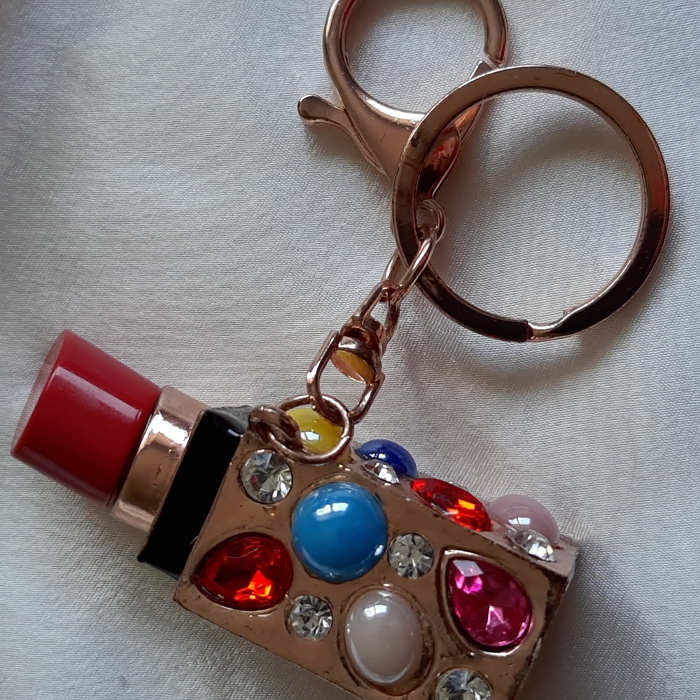 Keychain lipstick design. Gold tone with multi jewels.